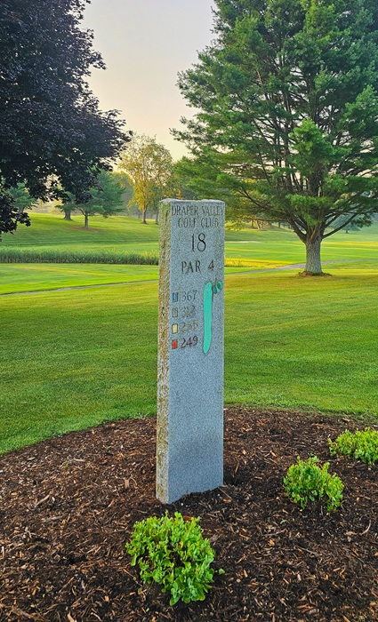 Hardwood mulch around a golf course hole marker at Draper Valley Golf Club, showcasing professional landscape use.